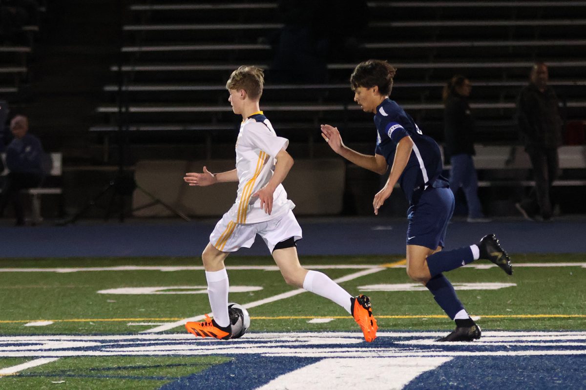 The Knights perform a give-and-go around a Carlmont player while running up the field. Simple plays like this prove to be effective when working towards the goal. This simple play allowed Menlo to advance to the goal for an opportunity to score.