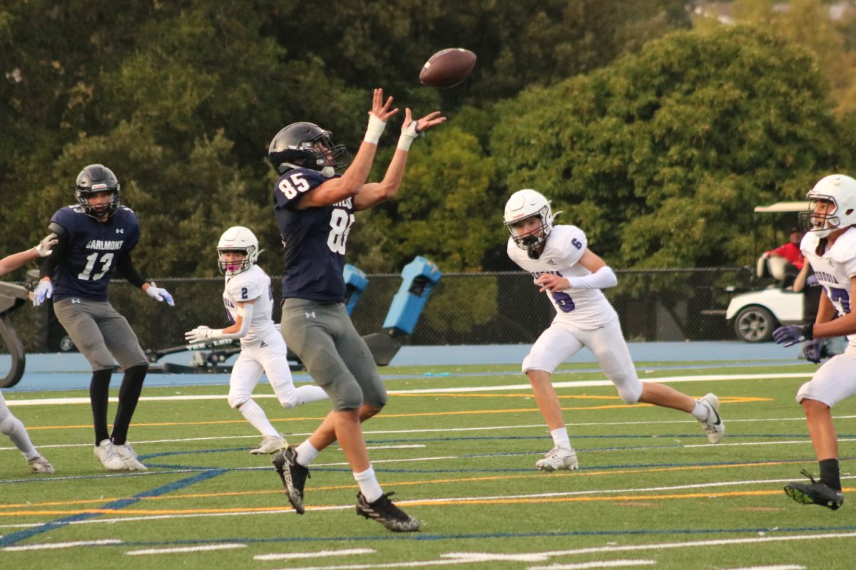 Andrew Dent catches a pass from quarterback Brody Zirelli. Dent gained seven yards on the play, bringing Carlmont to third-and-goal.