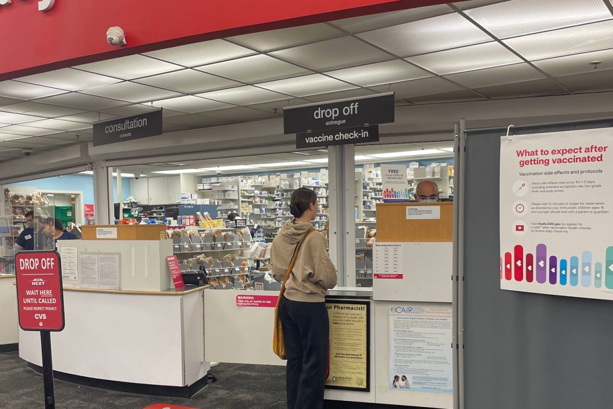 A customer checks in to get a vaccine at the CVS in San Carlos, where they offer many free vaccines, including ones for the flu, COVID-19, and more.