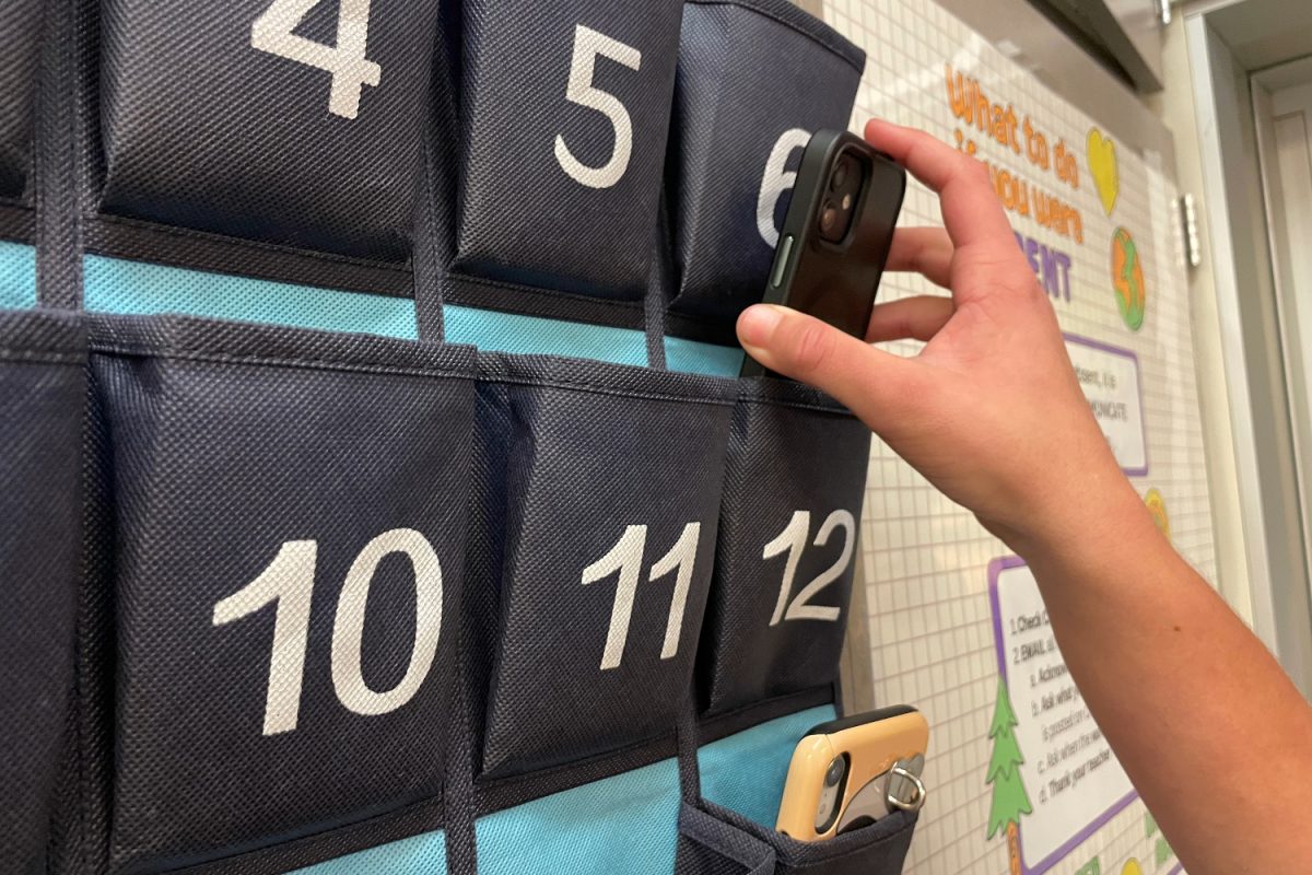 In some classrooms across campus, students put their phones into numbered phone pouches at the start of class. Putting phones away at the start of class makes students more present, according to Maddie Fox, a Spanish teacher at Carlmont.