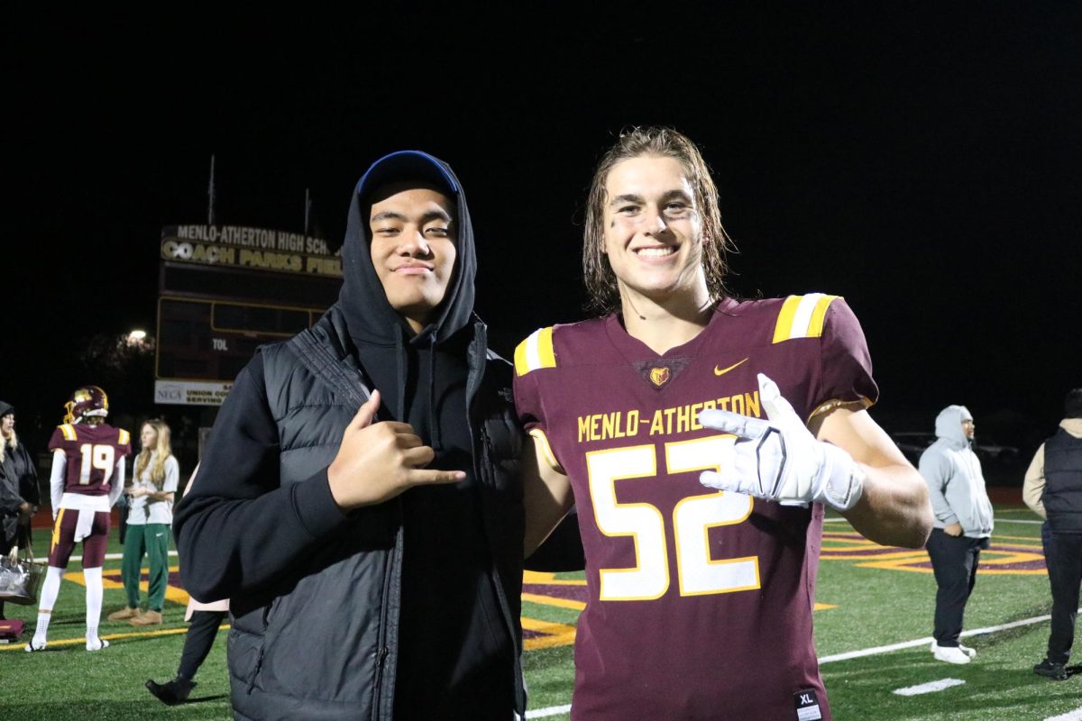 Devin Hyde and David Tangilanu pose for a picture together after M-As final game of the season. 