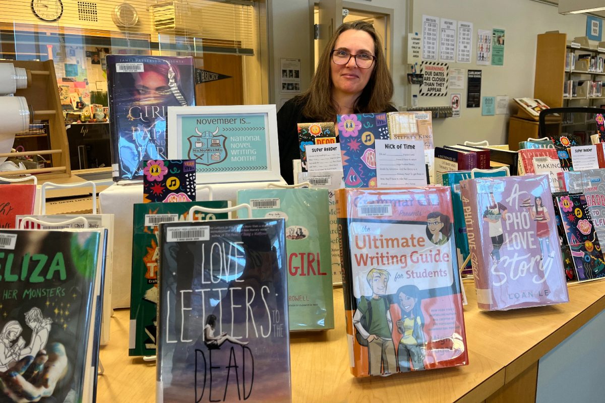 Alice Laine shows a book display in honor of National Novel Writing Month, the theme of this months Library Media Challenge. The books are currently displayed in the Carlmont Library.