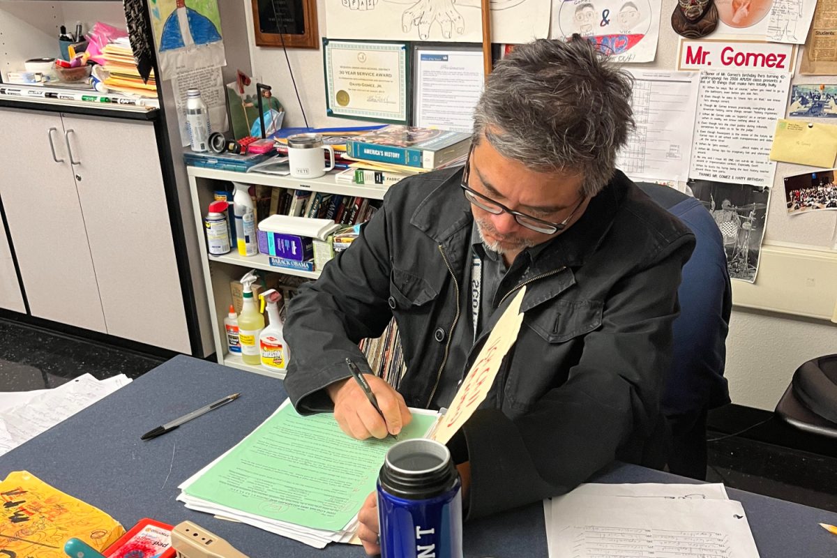 David Gomez, the supervisor for the Mock Trial Club, stays at school until 8 p.m. to supervise and organize a field trip for a scrimmage with another schools team.