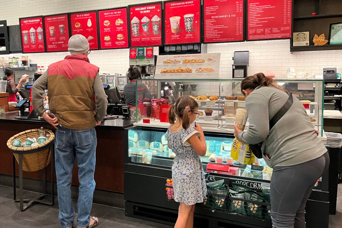 Shoppers+order+and+browse+items+at+the+Hillsdale+Mall+Starbucks.+With+the+recent+launch+of+the+holiday+menu%2C+Starbucks+has+joyfully+welcomed+an+influx+of+customers.