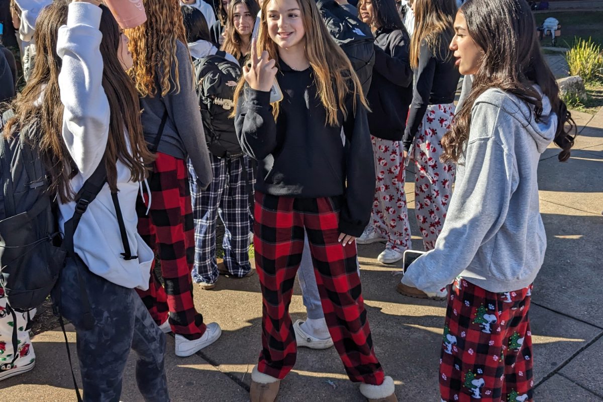 Students+gather+in+the+Quad+wearing+pajamas+for+the+last+spirit+day+of+the+week%2C+Pajama+Day.+They+wait+in+line+to+take+pictures+with+different+ASB+members+who+are+dressed+up+as+Santa+and+elves.