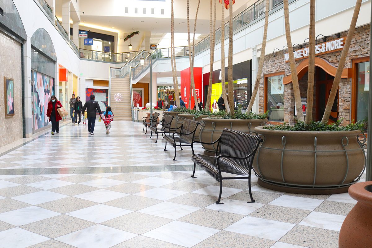 The+Hillsdale+Mall%2C+which+once+was+filled+with+vibrance+from+shoppers%2C+sits+desolate+with+posters+hiding+empty+retail+spaces.