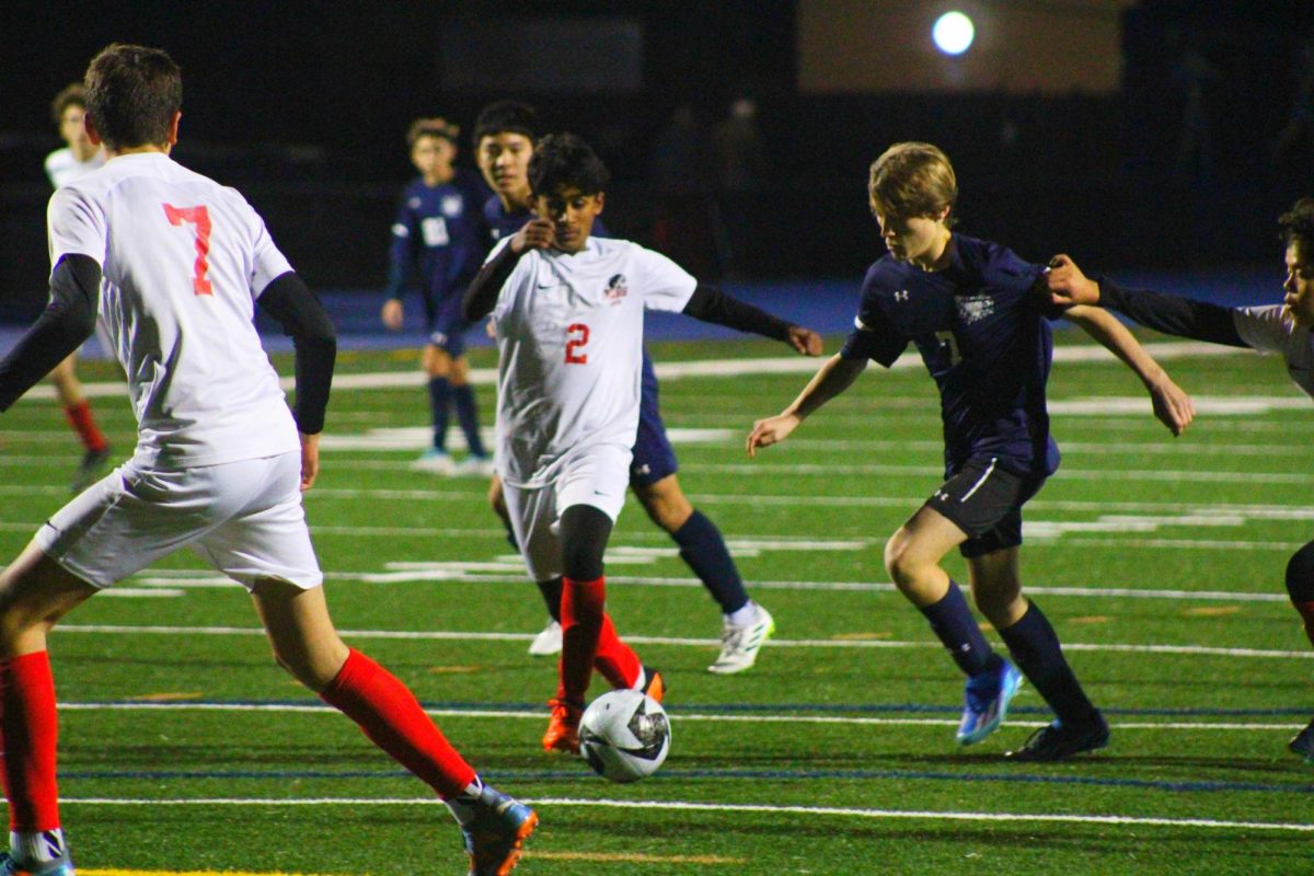 Freshman James Elliot takes a shot on goal. Elliot had little space because of three defenders surrounding him, but he was able to maneuver his way around them and shoot the ball. His shot was unsuccessful but kept the pressure on the Panthers.