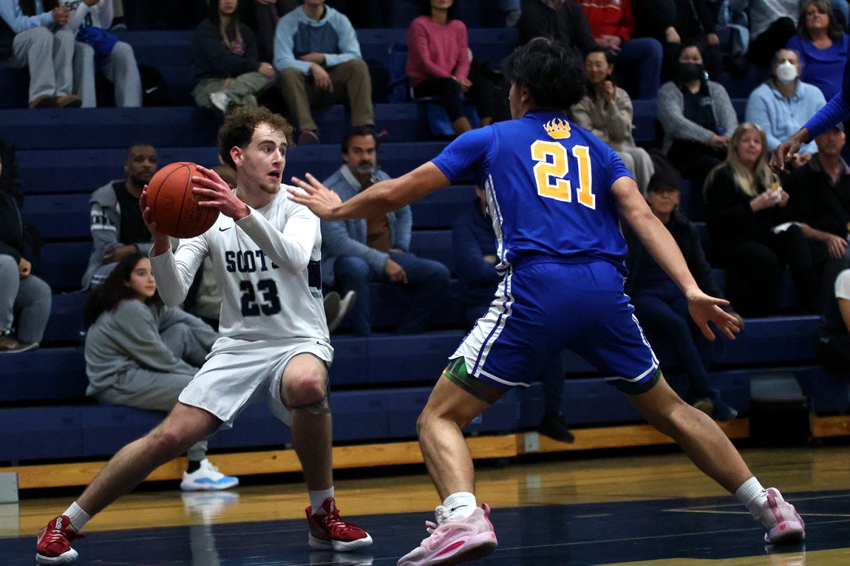 Senior Zachary Lefer fakes out the opponent to open up space for a pass. The Scots were able to execute many quick moves to create openings for plays or runs. This is what allowed them to outperform the Grizzlies in the offensive half of the court.