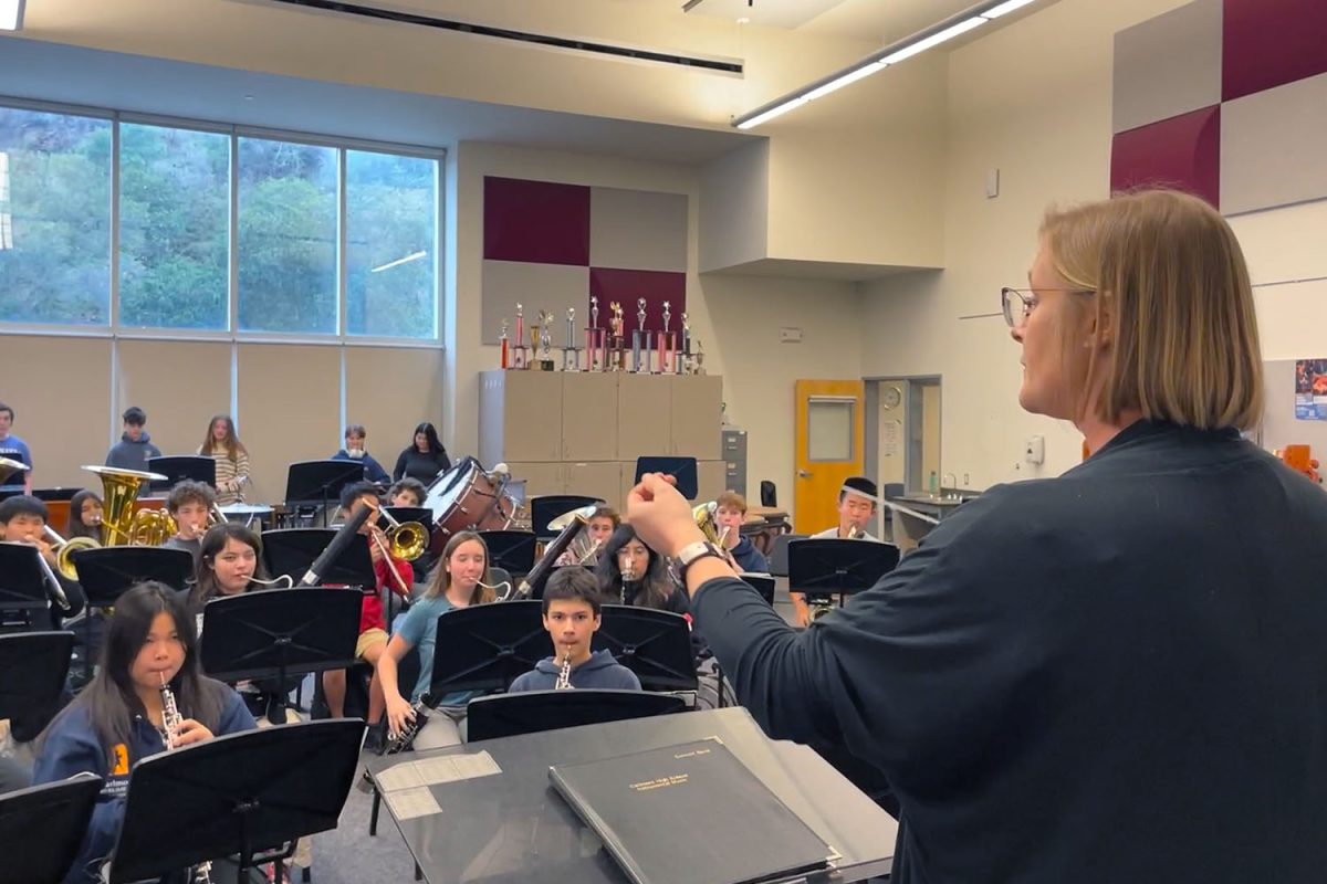 With a flick of her wrist, Jordan Webster gestures for the band to begin. Excitement fills the room as students get to start new pieces this semester.