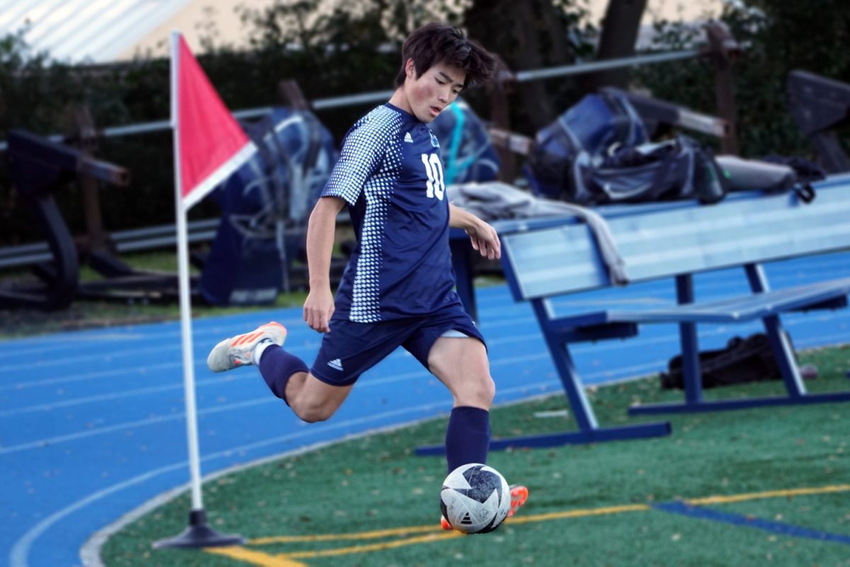 Kotaro Kikuchi crosses the ball off of a corner kick. The ball was deflected by the Ravens goalkeeper, and later cleared out of the dangerous area. Opportunities like these gave the Scots momentum throughout the match.