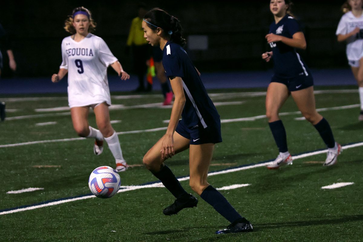 Freshman Rina Choe controls the ball in the midfield. Choe had time, as no defenders were pressuring her. This allowed her to look for an open pass to help advance the Scots toward the goal.