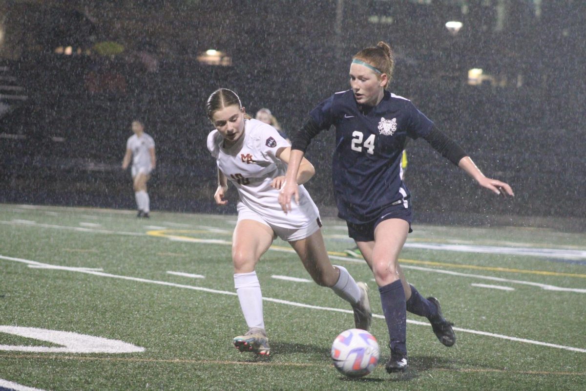 Freshman Delaney Kumer dribbles the ball around a Bears defender. She passed the ball to one of her teammates, leading to a corner kick. The Scots had many opportunities from crosses throughout the game, and Kumer scored one herself.