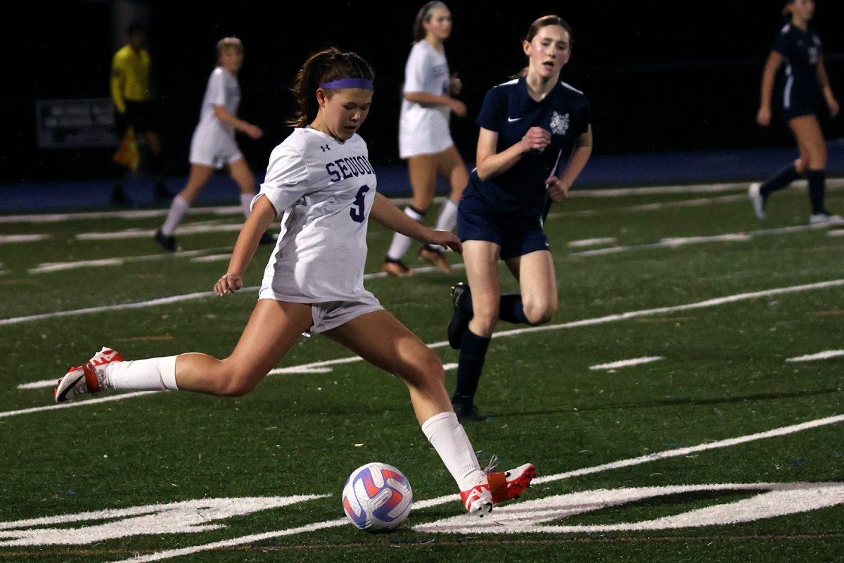 A Sequoia midfielder distributes the ball toward the side of the field. The Ravens exploited the Scots by passing long-balls toward their wingers. The Scots quickly recovered on many of these plays, only allowing one goal during the game.