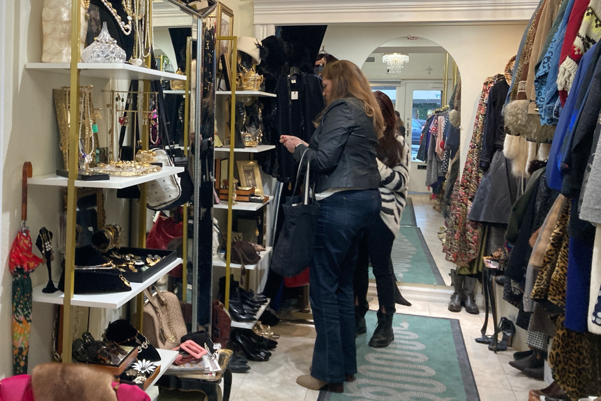 Within the Sainted Goods Boutique, Noelle Galvez assists a customer in choosing a piece of jewelry. The COVID-19 pandemic forced many businesses to close, but it also provided an opportunity for new businesses to open.
