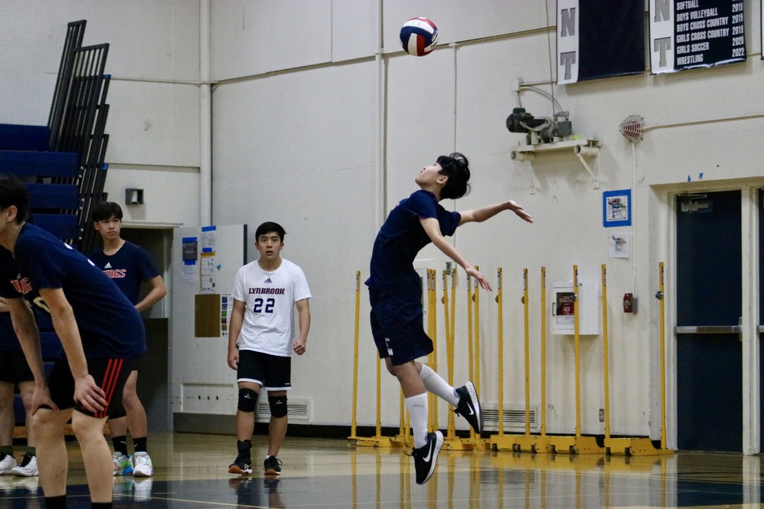A player from the Lynbrook Vikings serves the ball at the beginning of the second set. The Vikings had more opportunities to serve the ball in the second and third sets than in the first. They reached 25 points in the second set and 15 points in the third set before the Scots could gain a lead on them.