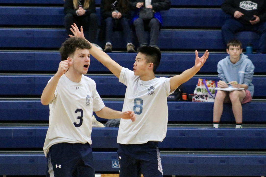 Freshman Justin Wong triumphantly throws his arms up to celebrate Lima Duvais successful hit. Wong is an opposite hitter for the Scots. Throughout the game, he wasnt afraid to fall from blocking the Vikings fast attacks or to dive from keeping the ball off the ground.