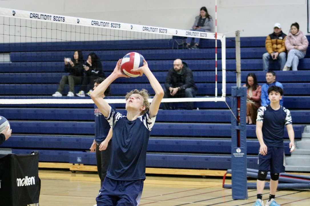 Freshman setter Alan Fadayev sets the ball to a teammate during practice. One of his main responsibilities as a setter is to set the ball, so one of the hitters can attack. In the first minute of the game, Fadayev scored the first point for the Scots.