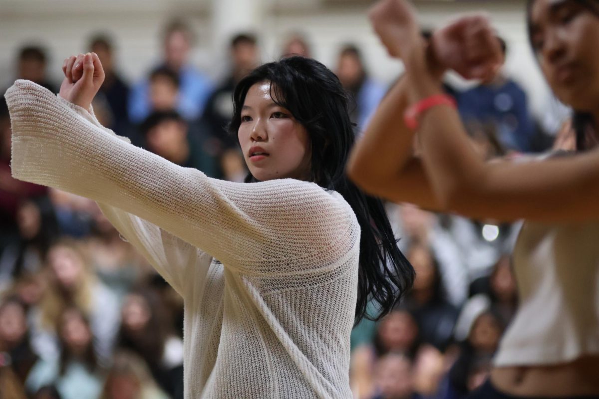 Junior Kyra Lu dances for the Korean Culture Club. The members performed three different dances, one faster-paced than the others. The dances combined elements of hip-hop and jazz and were choreographed to match Korean pop music.
