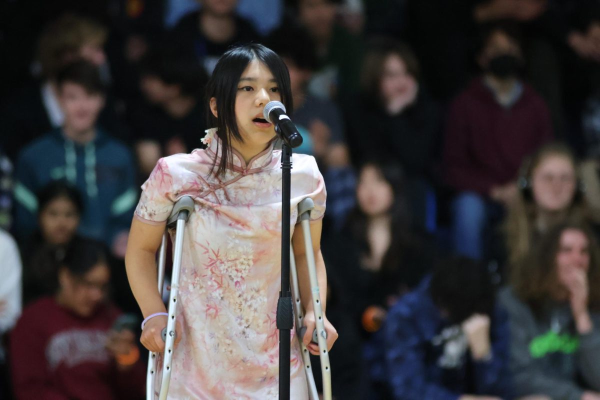 Junior Claire Lee performs a solo on behalf of the Chinese Culture Club. Lee sang “GongXi GongXi, which translates to “Congratulations, congratulations” in English. Chen Gexin originally wrote the song to celebrate Japans defeat and Chinas liberation at the end of World War II.