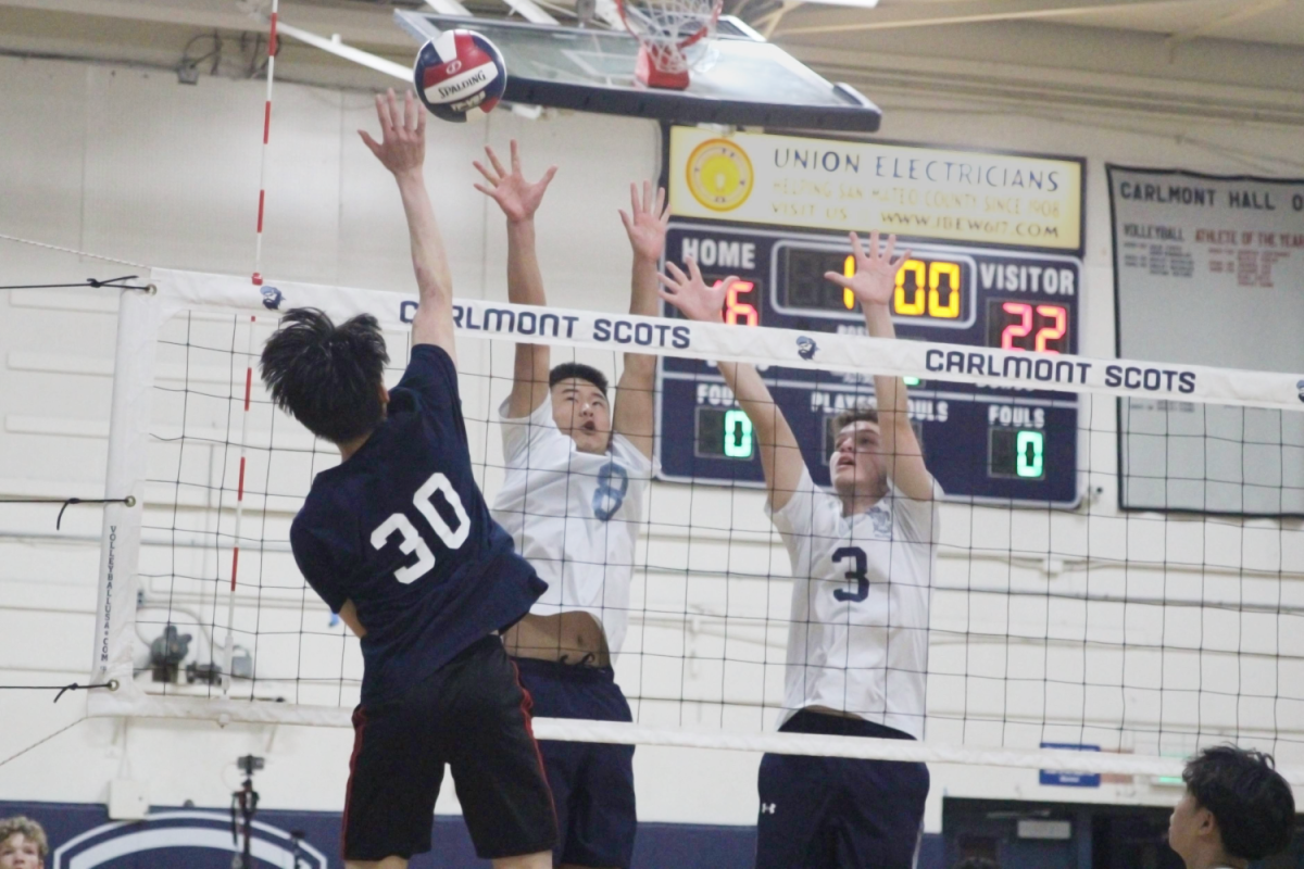 Sophomore Mateus Duvai and freshman Justin Wong block a spike by the Vikings. This rally ended in a point for the Scots after the Vikings could not return the block. The Scots had lots of success from blocking because of their height and athleticism. “I think we did a good job blocking many of their spikes, and our defense was pretty effective,” Wong said.