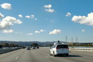 An autonomous Waymo car drives on U.S. Highway 101 in Burlingame, Calif.