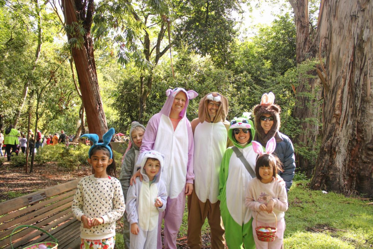A group of parents and their children dressed up as easter bunnies. In the spirit of the season, some families wore bunny ears and costumes as they walked around the event.
