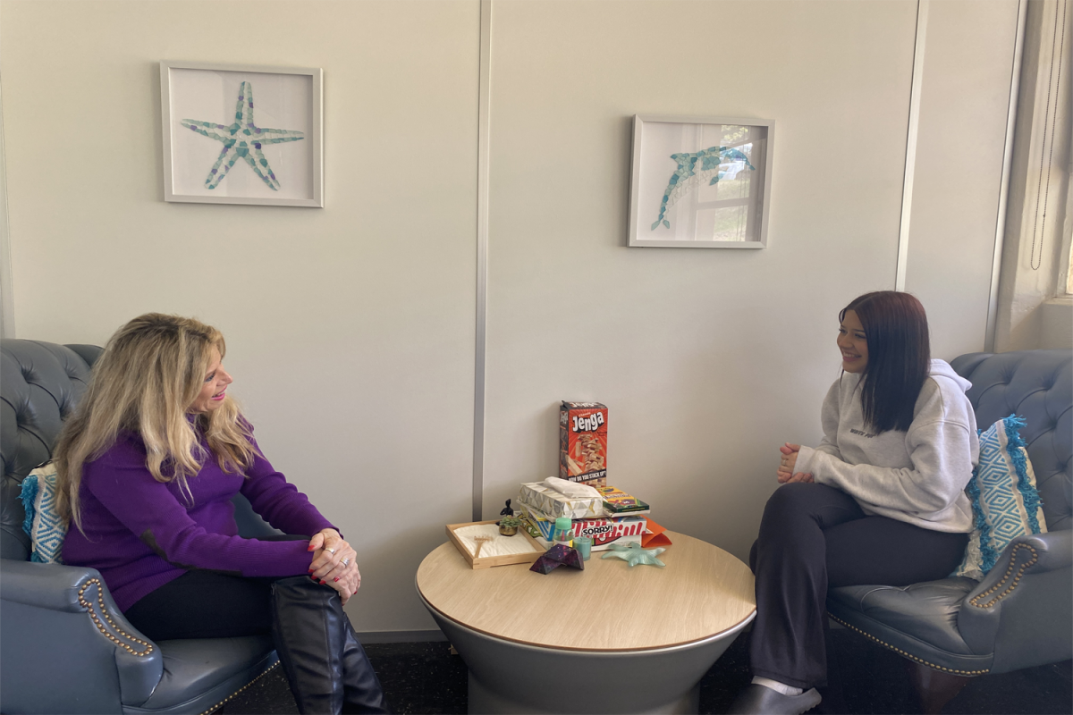 Shelley Bustamante talks to one of her students about her well-being. Many students have improved their social skills and gained deeper self-awareness because of her.