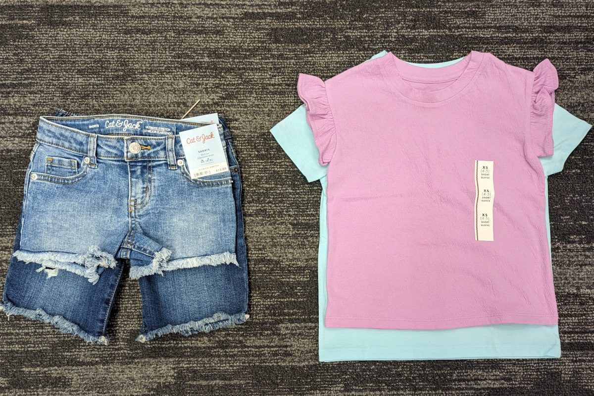 This+is+a+side-by-side+comparison+of+clothes+for+a+young+girl+versus+for+a+young+boy.+They+are+the+same+size+and+style%2C+yet+the+girls+shirt+and+shorts+are+significantly+shorter+than+the+option+for+boys.