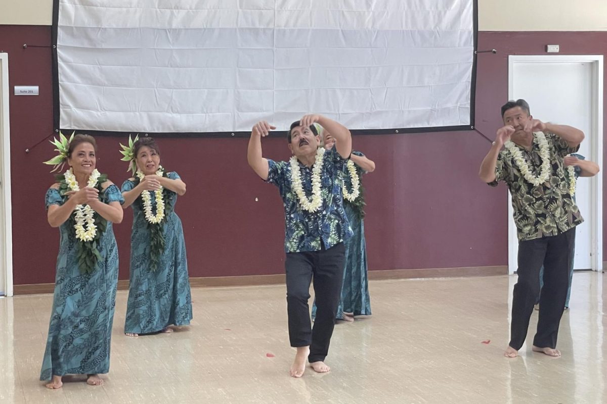 A group of AAPI dancers perform their dance to a Hawaiian song relating to their ethnic origin. During the festival, numerous performances embraced diverse cultural backgrounds. “I learned a lot more about how the dancing tells a story and hear the details of how the hula tells a story,” said volunteer Shannon Cheng. “Also, its a way to pass down stories through generations.” 
