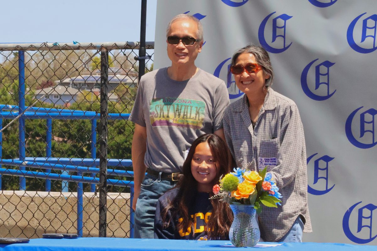 Kelsey Leung receives support from her parents on senior signing day. She will be attending the University of California San Diego to further her swimming career as a Division I athlete. Leung was chosen as a First Team All-League swimmer this year.