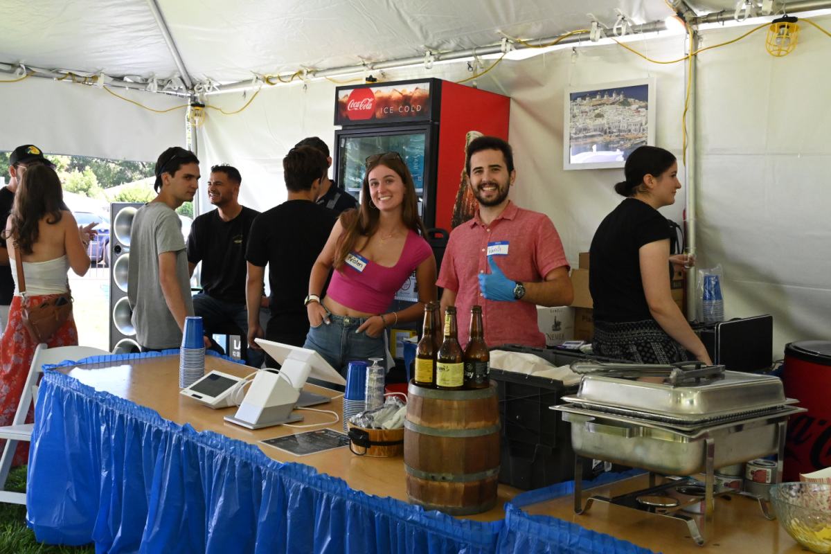 Two volunteers help run the beer garden, a new addition to this year's festival. "We're hoping the beer garden is a way to get younger Greeks to help out at the festival and to keep everyone together," said Chris Mattis, one of the creators of the beer garden booth. According to Mattis, all the beers are imported from Greece, making them hard to find in local markets.