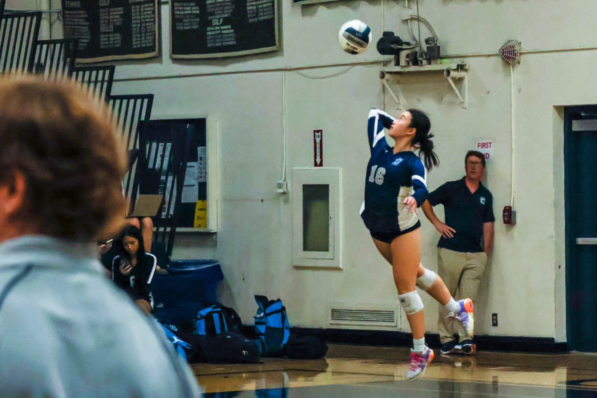 Junior Clare Wang gracefully serves the ball to the opposing side. The serve is a crucial aspect of volleyball as often puts the opposing team in a challenging defensive position. Serving is also quite complex and requires skill in many aspects, such as hand-eye coordination, timing, and ball control. 