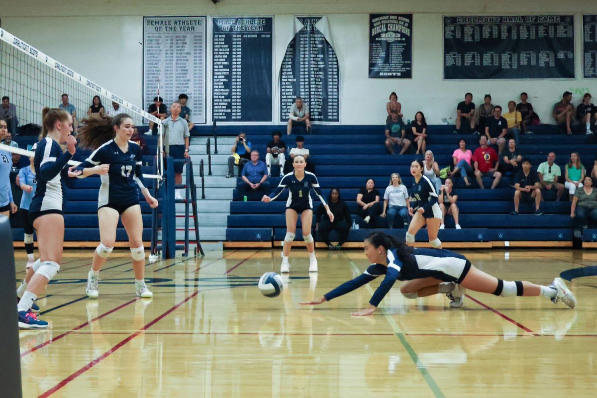 Junior Athena Chui dives for the ball, hoping to keep it in play. Throughout the game, the Bears made many strong offensive plays, which helped them raise a lead against the Scots. The strong offense of the Bears also forced the Scots to make tougher defensive maneuvers, such as dives, to keep the ball in play.