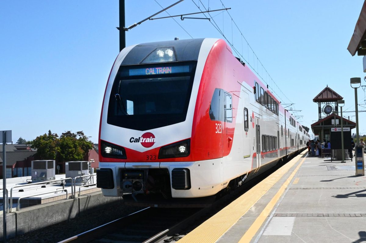 Caltrain's new electric train stops at the Belmont Station and picks up passengers. Since its first study looking into a possibility of electric trains in 1992, Caltrain's newest fleet allow for trains that are faster, more frequent, and better for the environment. Along with their new fares, these trains are connecting commuters from San Francisco to Gilroy. 