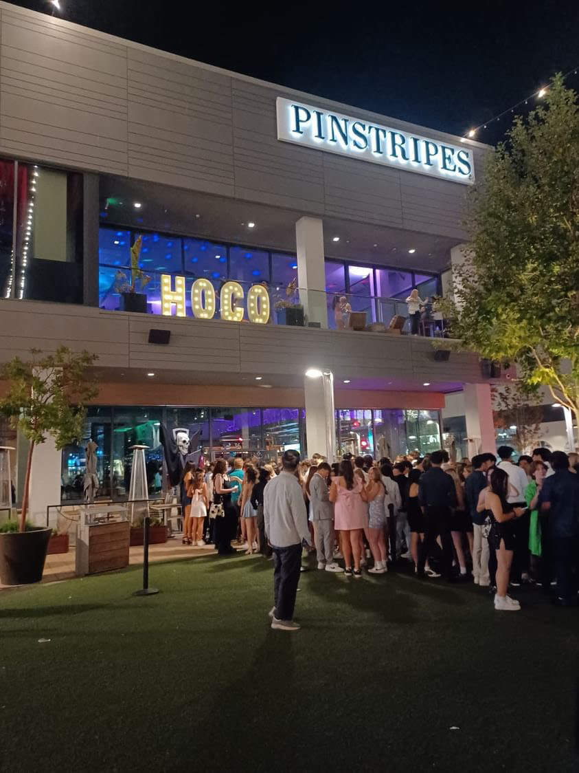 Students lined up as they awaited to enter Pinstripes after the doors opened. The annual event brings together the school community. 