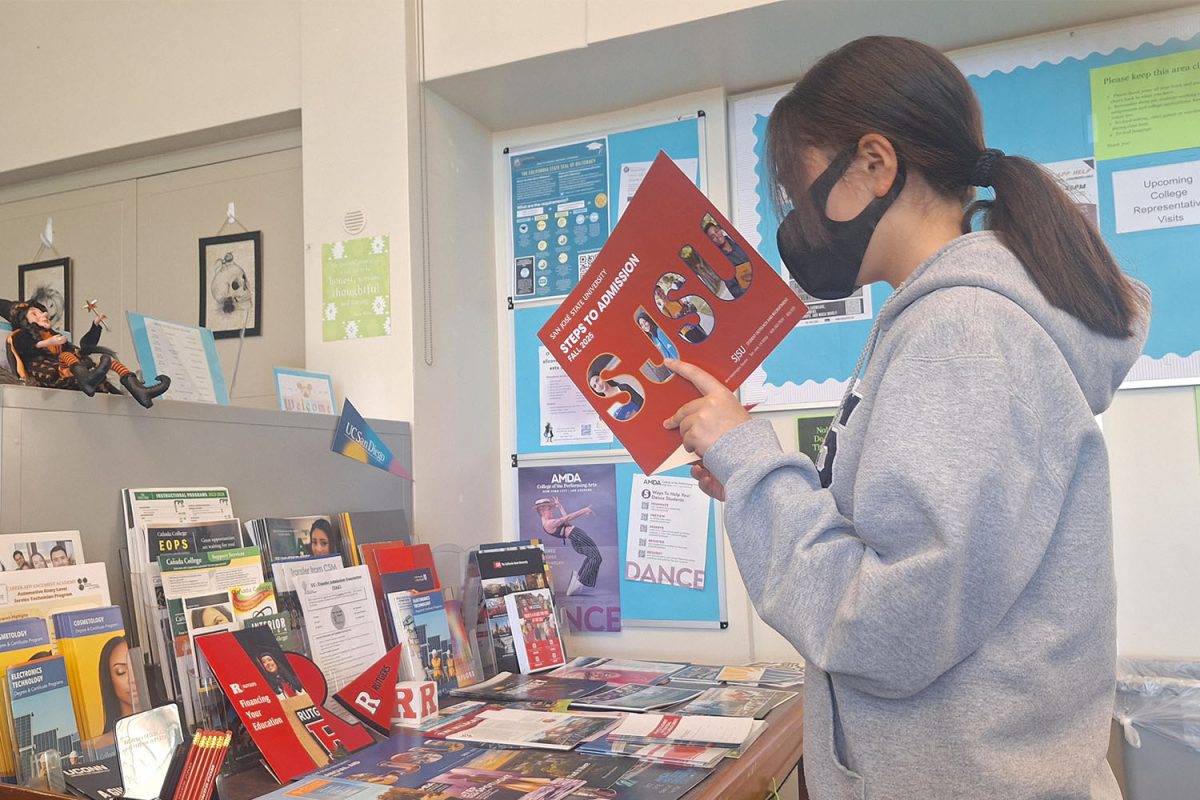 A student peruses the pamphlet for information about the admission process to San Jose State University (SJSU) in the College and Career Center. As Carlmont seniors go through the college applications process, the College and Career Center offers a variety of resources to assist them in this busy time.