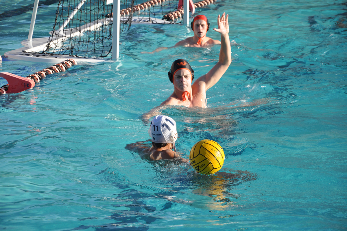 Carlmont senior Griffin Klose comes face to face with a Woodside player and looks to score during the second quarter. The Scots were down 4-1 at the second quarter start, making scoring opportunities like this crucial.