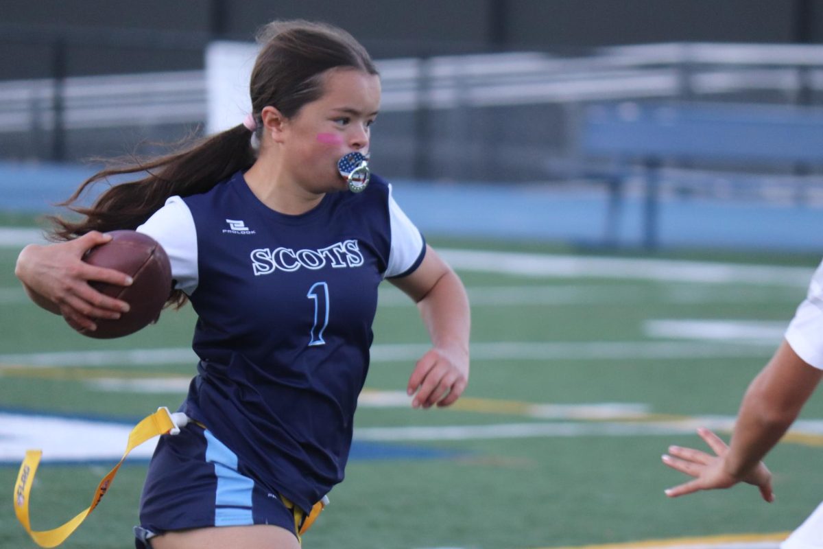 Sophomore Chloe Taylor carries the ball to the end zone in the beginning of the second half. Taylor scored the first touchdown of the game in this half. This touchdown started the momentum against the Vikings.