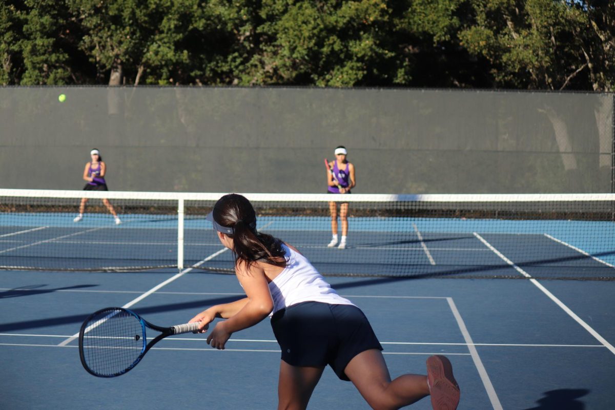 Sophomore Chloe Rui launches a strong diagonal serve to the opponents. The serve wasn't returned and helped the Scots doubles become a point closer to victory. Due to this pivotal point, the Scots were able to easily win the next few serves, resulting in the win. 