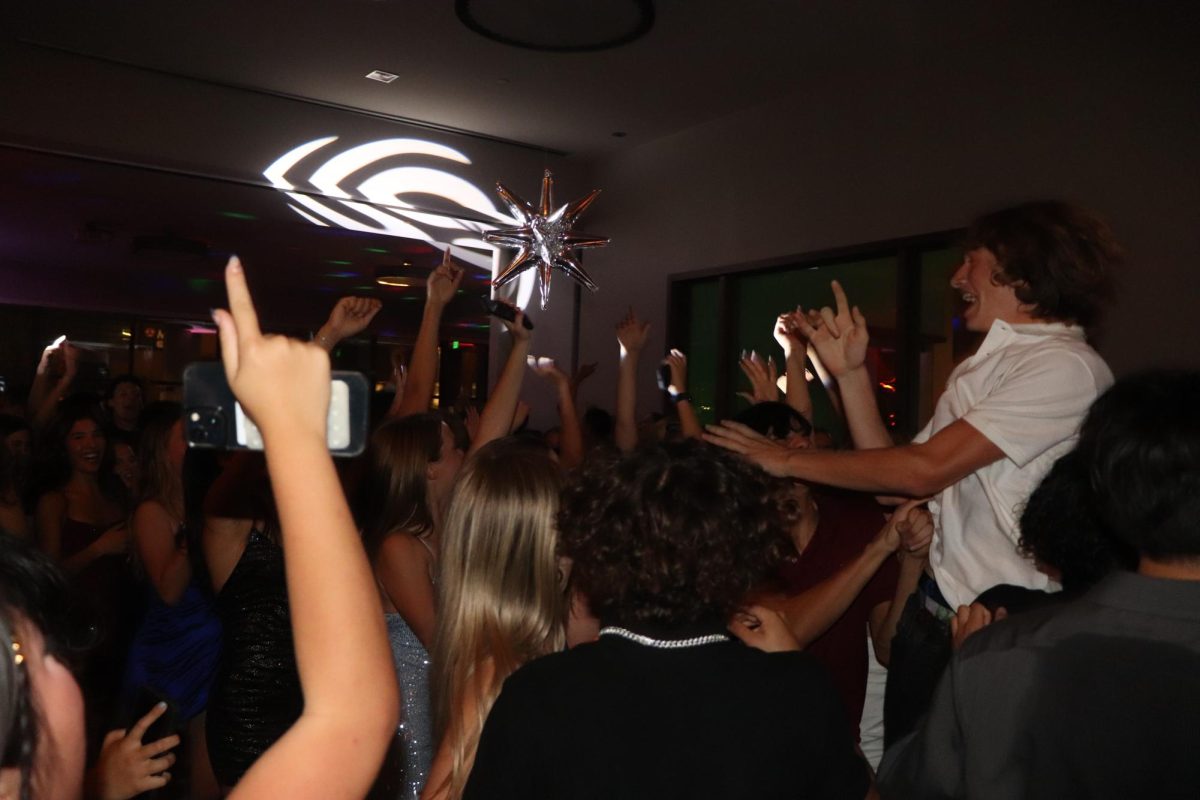 The dance floor at Pinstripes radiates a vibrant feeling as students celebrate homecoming. The event fosters school spirit and is held every year. 