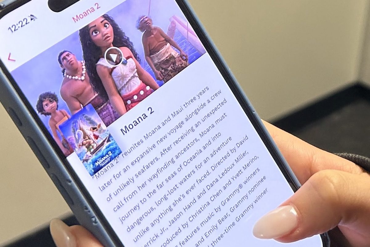 A Carlmont student looks at the "Moana 2" page on the Cinemark app.