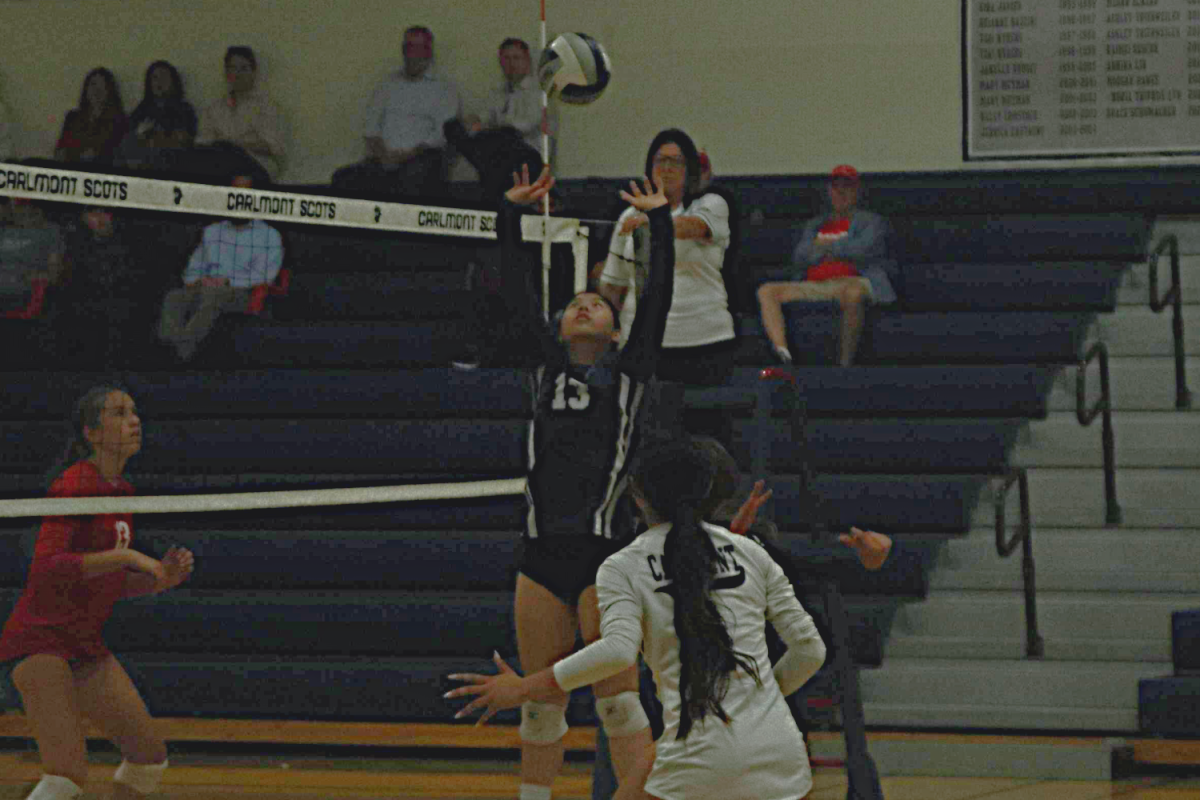 Carlmont sophomore Ashlyn Wong sends the ball back over the net in a tense moment against the Panthers. This was a key moment in the game. Wong's accurate set helped her team win more points in order to win the game. 