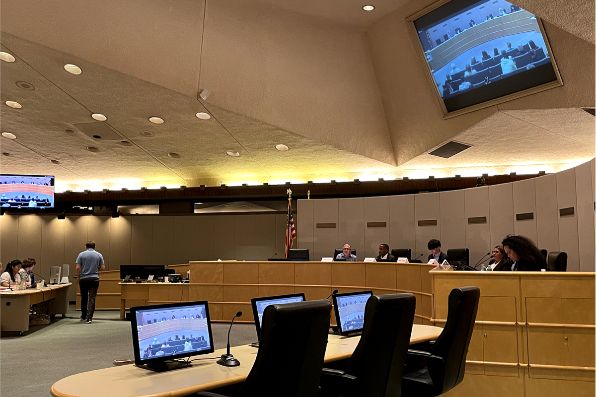 SUHSD candidates sit in the Redwood City council chambers awaiting their next question. They listen attentively to community members' questions.