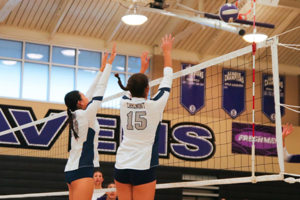 Carlmont juniors Athena Chui and Chloe Harris go for the block. Their efforts on along the net played a big role in the Scots' victory. The outside hitters duo are strong force on defense.