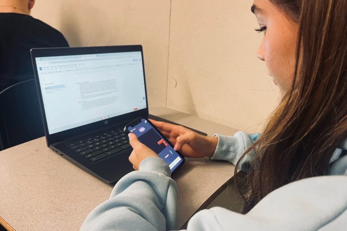 A Carlmont student focuses on a game of Block Blast during class.