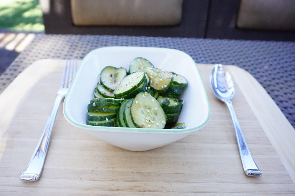 A fresh cucumber salad sits ready to serve, part of a popular TikTok trend that has sparked concern following a recent Salmonella outbreak. Cucumbers require constant moisture to grow, putting them at risk for waterborne food illness.