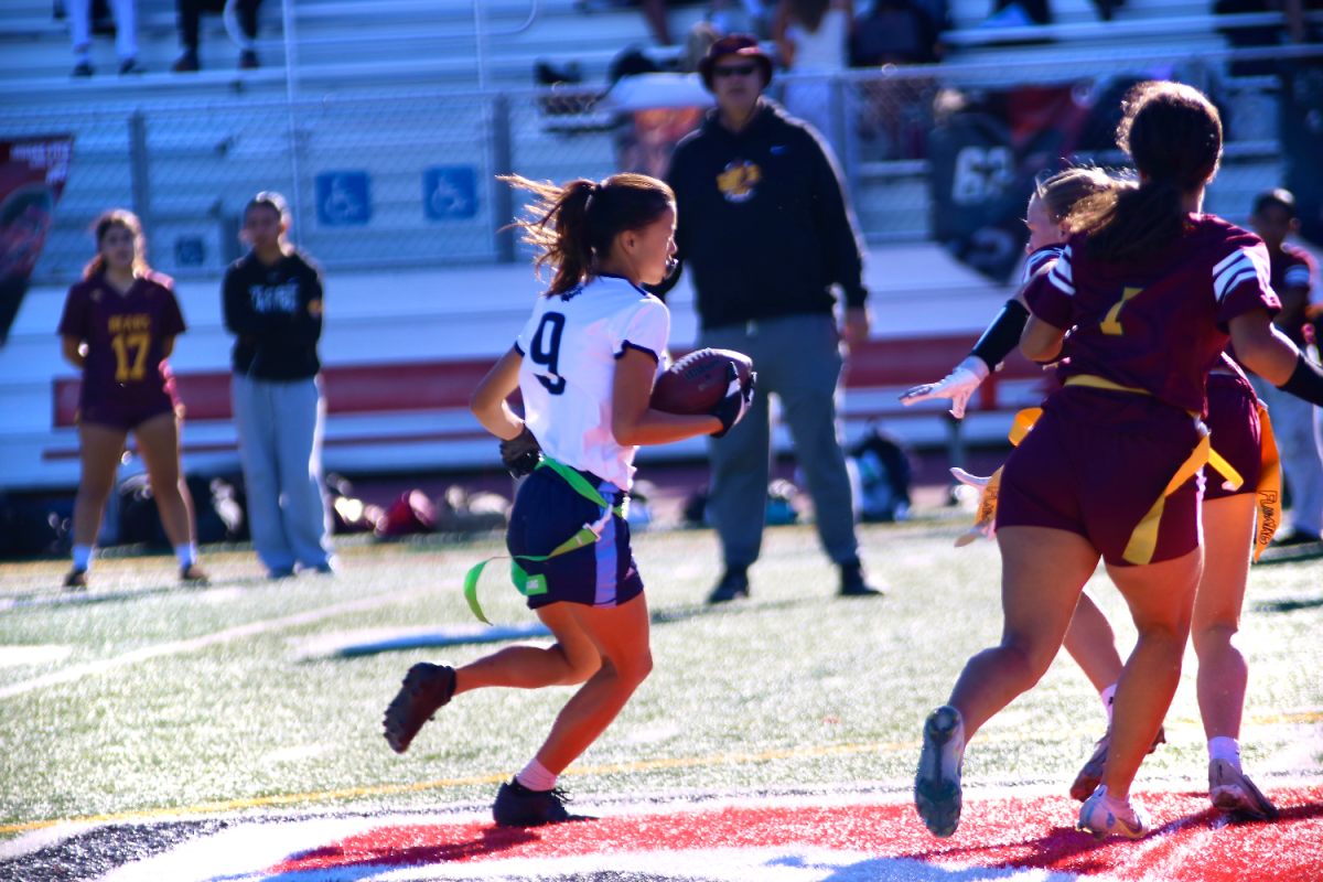 Running back Hailey Dao runs through the defenders for a first down. She is a key player in the Scots’ run game. Dao also plays linebacker on defense for the Scots.