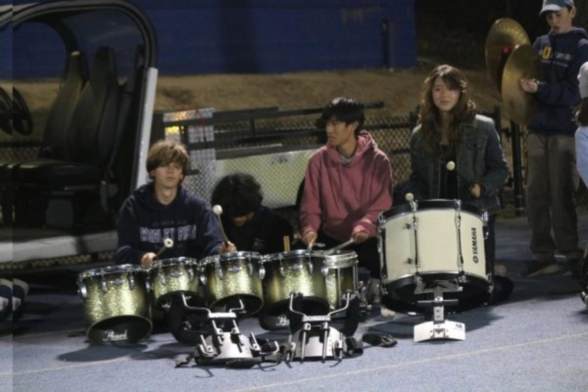 Drumline plays on the sidelines at a Carlmont home football game. Drumline's participation in the games help raise school spirit from the field to the stands. 