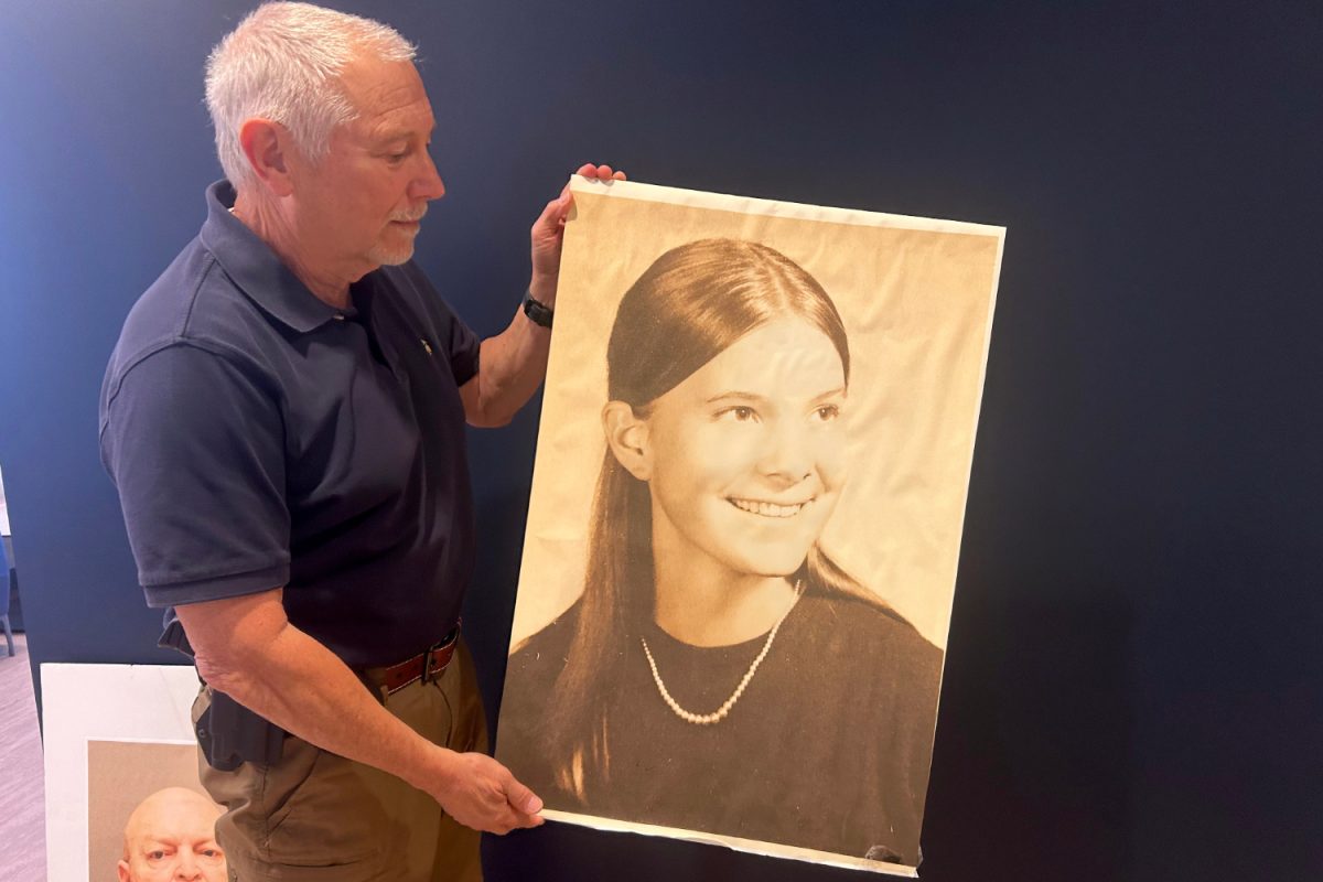 San Mateo County Sheriffs Office Detective, David Trestmontan, holds an image of Janet Taylor. They keep cardboard cutouts of both Taylor and John Getreu, her murderer. "Out of respect, we had those together tucked away but we didn't put them facing each other. She shouldn't have to look at him," said Rick Jackson, another detective. 