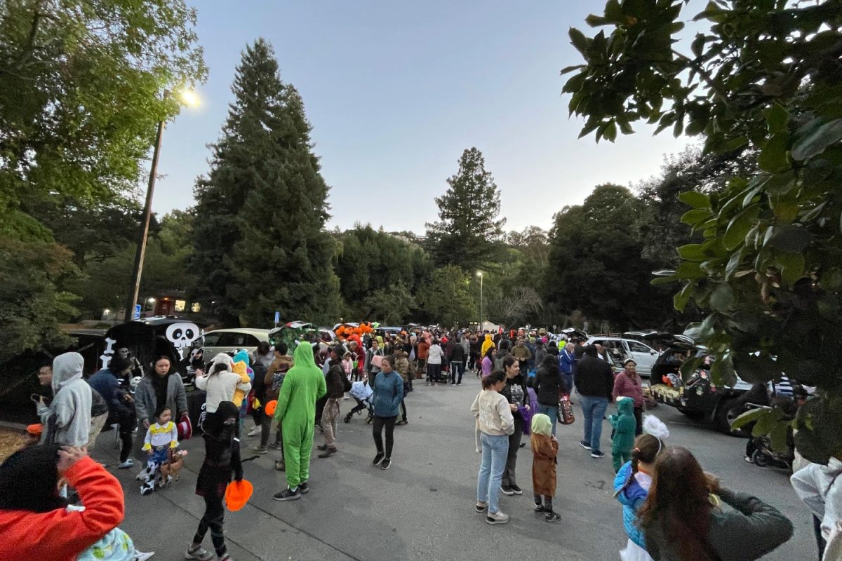 Families gather at the crowd at the first Trunk-or-Treat last year. 